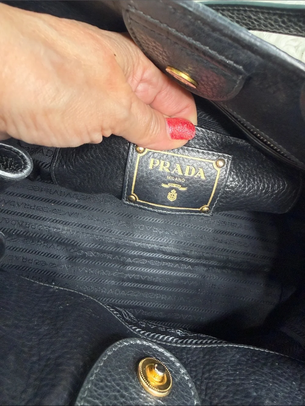 Authentic Prada Black  Leather Satchel with Gold Logo .